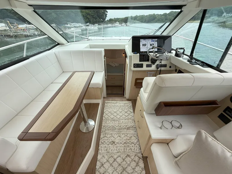 Slide: The Image of Luxurious interior of 2025 Regal 38 FXO yacht with modern helm and seating. - 22