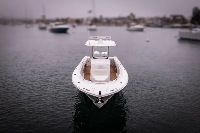 Slide: The Image of 2017 Edgewater Center Console boat on calm water, overcast sky. - 15