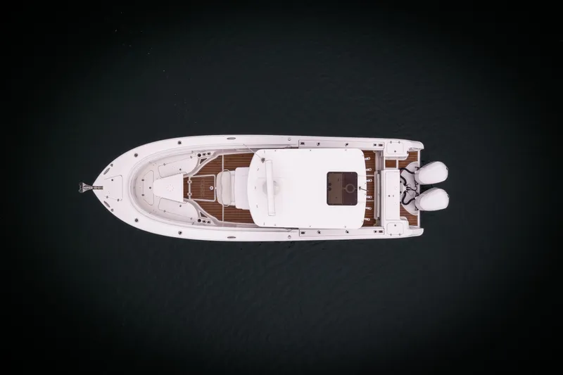 Slide: The Image of Aerial view of 2017 Edgewater Center Console boat on dark water. - 16