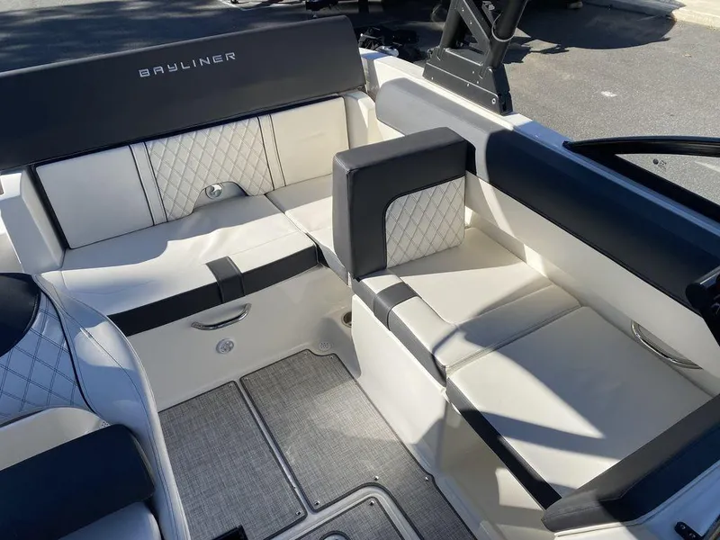 Slide: The Image of 2023 Bayliner DX2050 boat interior with stylish seating and modern design. - 10