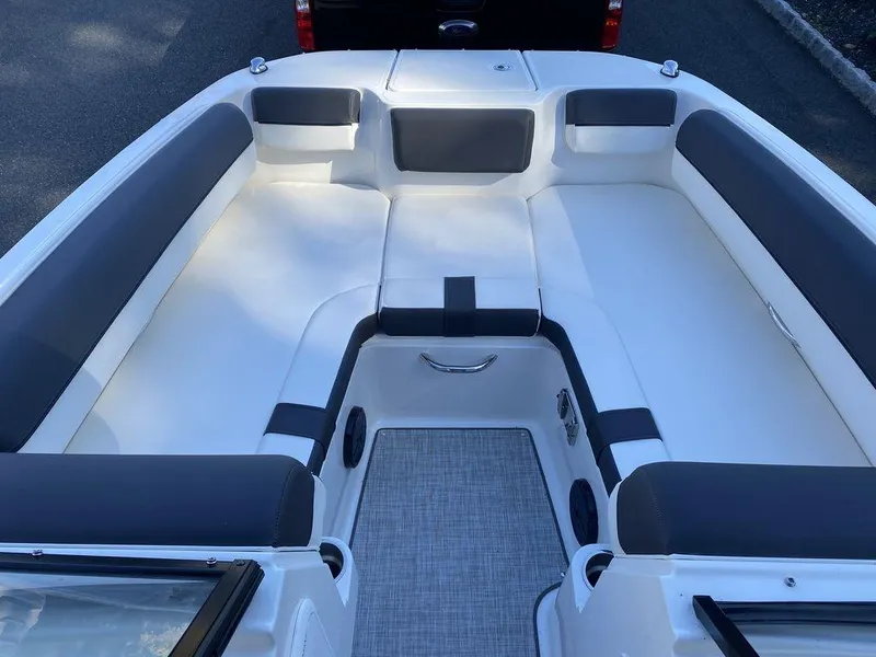 Slide: The Image of 2023 Bayliner DX2050 boat interior with spacious seating and modern design. - 11