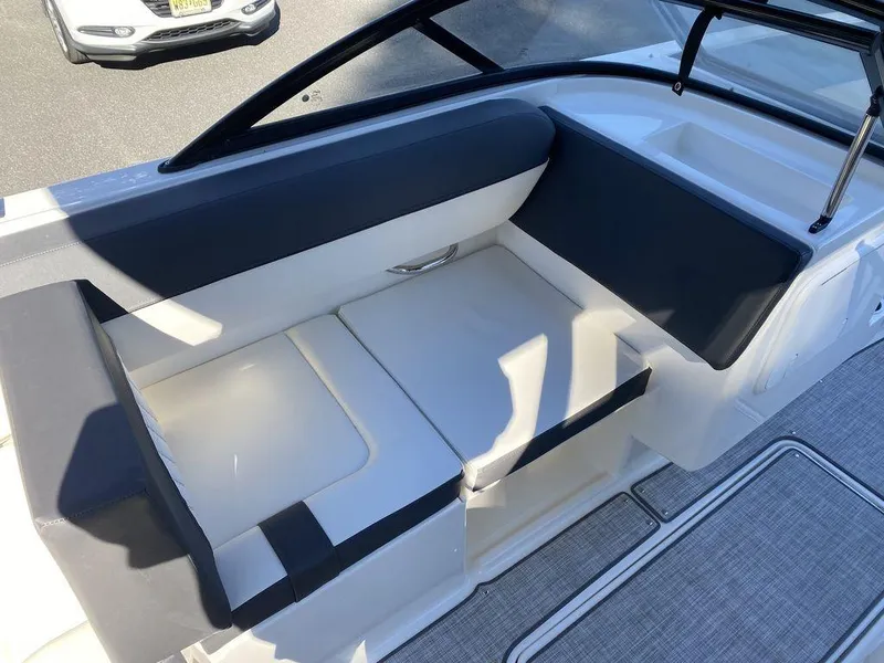 Slide: The Image of 2023 Bayliner DX2050 boat interior seating with modern design and comfortable cushions. - 18