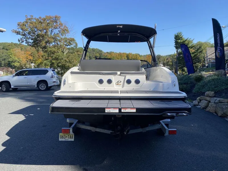 Slide: The Image of 2023 Bayliner DX2050 boat, rear view, parked outdoors. - 3