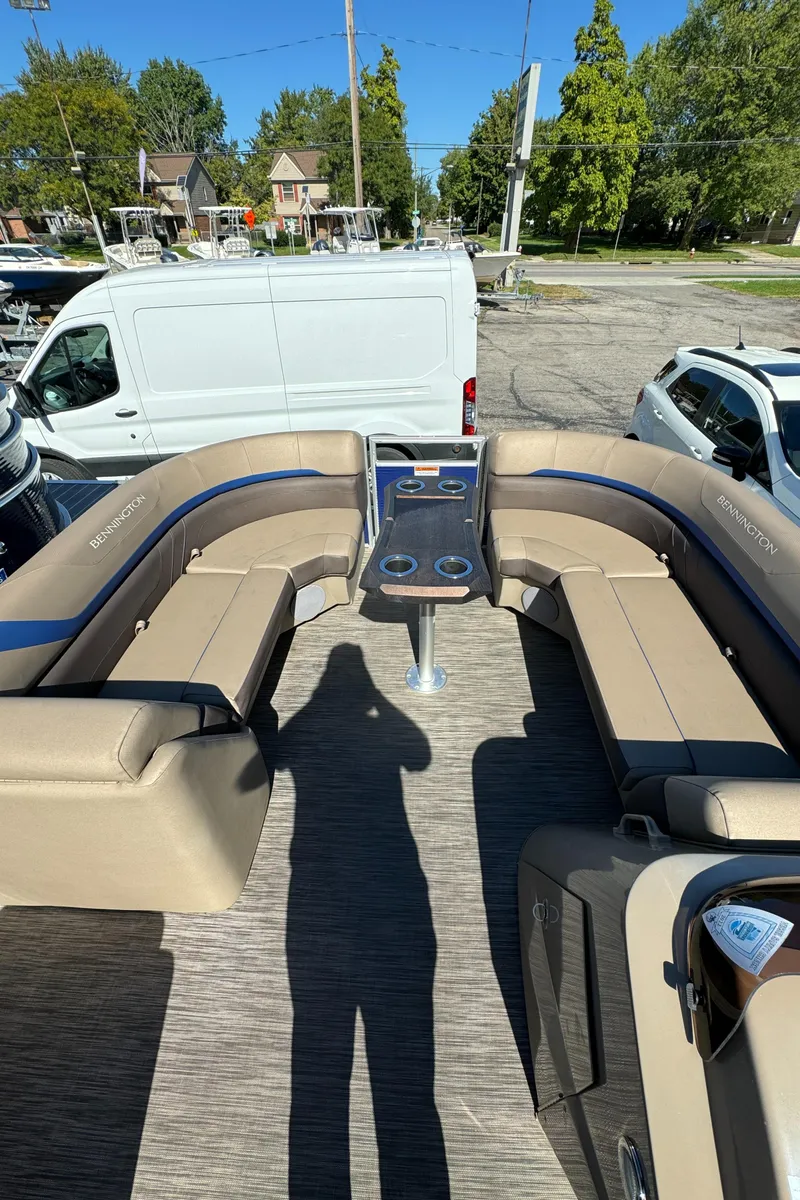Slide: The Image of 2022 Bennington Cruiser 230 interior with beige seating and central table. - 11