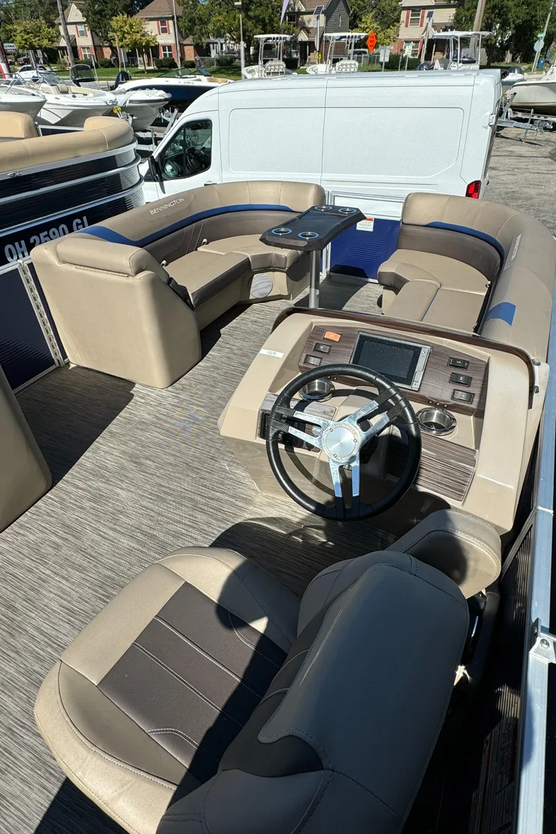 Slide: The Image of 2022 Bennington Cruiser 230 interior with plush seating and modern dashboard. - 12