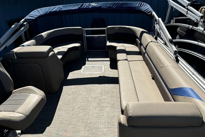 Slide: The Image of 2022 Bennington Cruiser 230 interior with spacious seating and modern design. - 13
