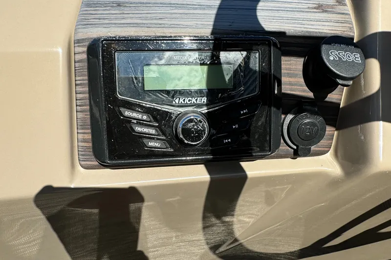 Slide: The Image of Kicker audio system on 2022 Bennington Cruiser 230 dashboard. - 17
