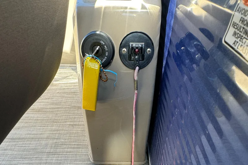 Slide: The Image of Close-up of ignition and control panel on 2022 Bennington Cruiser 230 boat. - 20