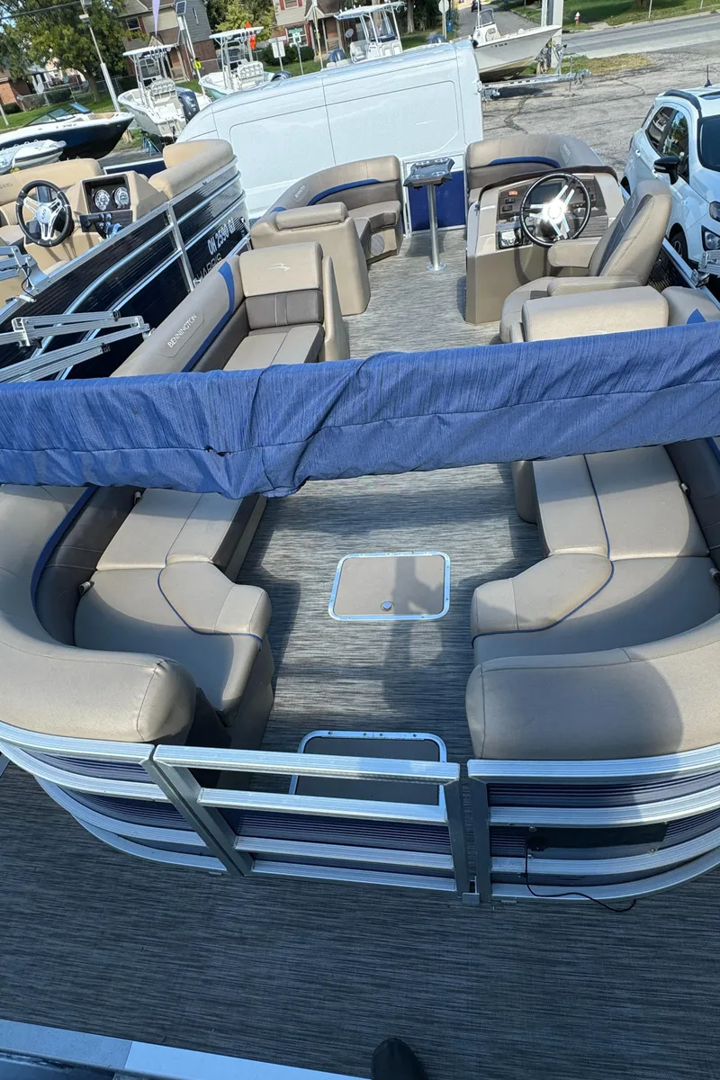 Slide: The Image of 2022 Bennington Cruiser 230 pontoon boat with spacious seating and modern design. - 24
