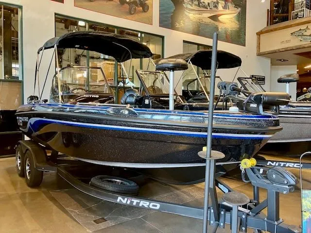 The Image of 2024 Nitro ZV19 Pro boat displayed in showroom, featuring sleek design and modern equipment. - 0