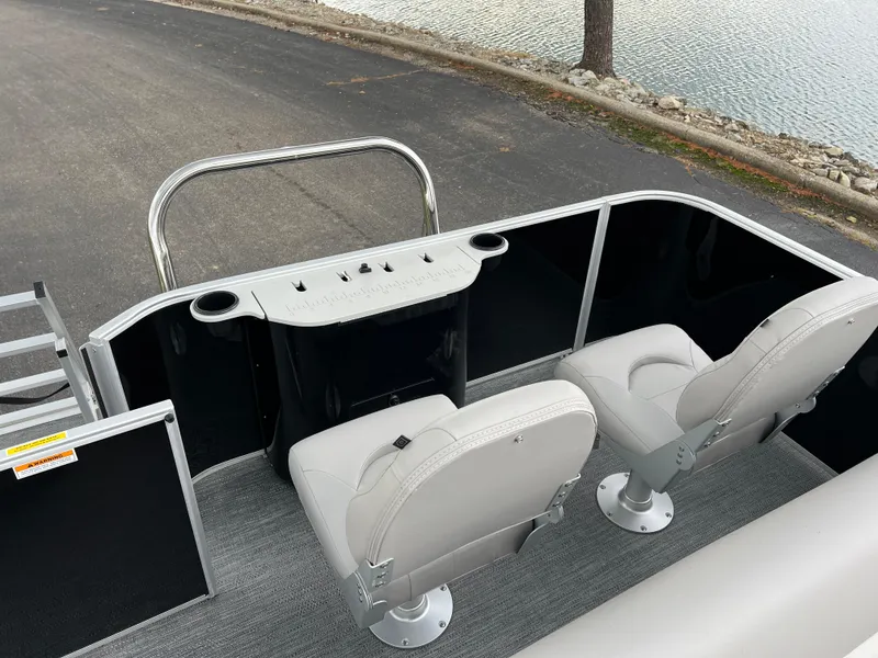 Slide: The Image of 2025 Godfrey Xperience 2086 FX boat interior with two seats and control panel. - 14