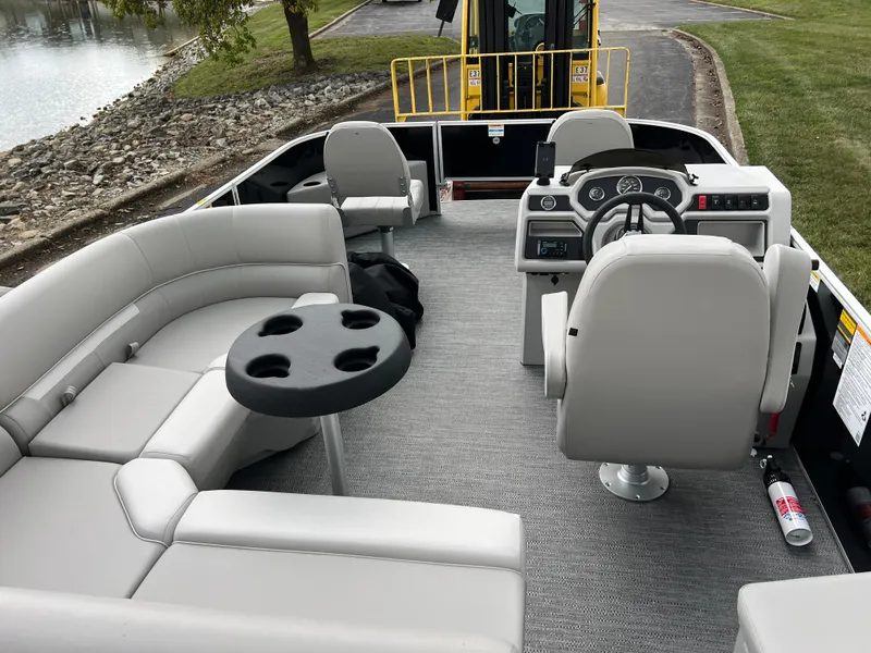 Slide: The Image of 2025 Godfrey Xperience 2086 FX pontoon boat interior with seating and steering console. - 18