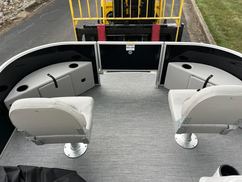 Slide: The Image of 2025 Godfrey Xperience 2086 FX boat interior with seating and storage compartments. - 21