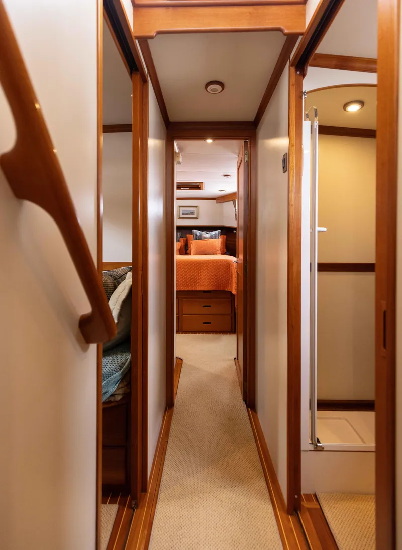 Slide: The Image of Interior hallway of 2005 Grand Banks Europa yacht, featuring wood accents and cozy cabin. - 17