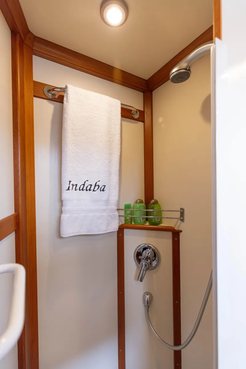Slide: The Image of Shower area in 2005 Grand Banks Europa yacht with towel and toiletries. - 24