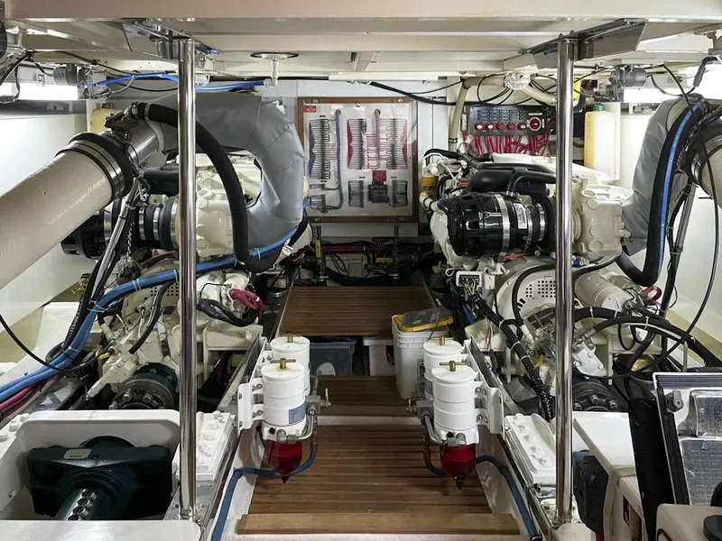 Slide: The Image of Engine room of 2005 Grand Banks Europa yacht, showcasing dual engines and mechanical systems. - 28