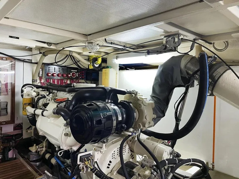 Slide: The Image of Engine room of 2005 Grand Banks Europa yacht, showcasing detailed mechanical components. - 29