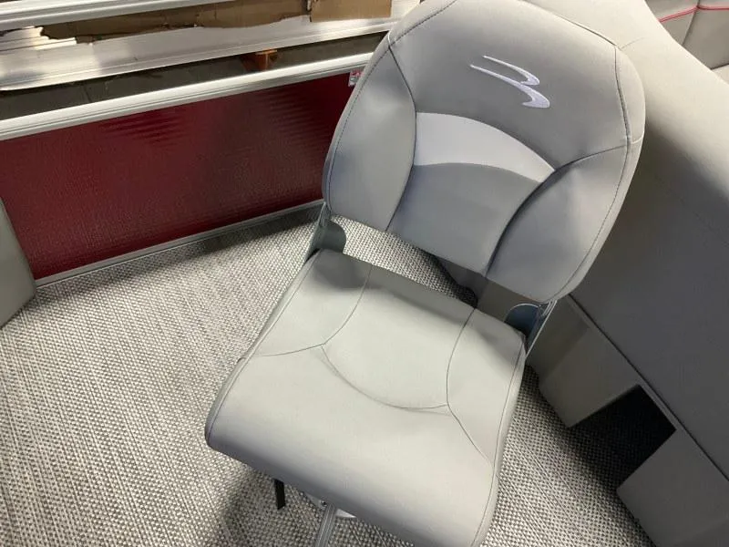 Slide: The Image of 2023 Bennington 20SVF boat seat, gray upholstery, modern design, on textured flooring. - 14