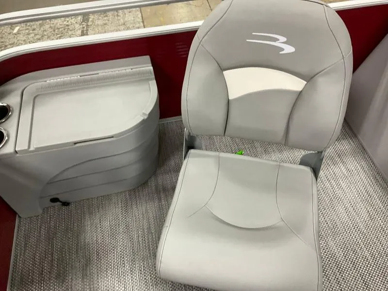 Slide: The Image of 2023 Bennington 20SVF boat interior with gray captain's chair and console. - 16