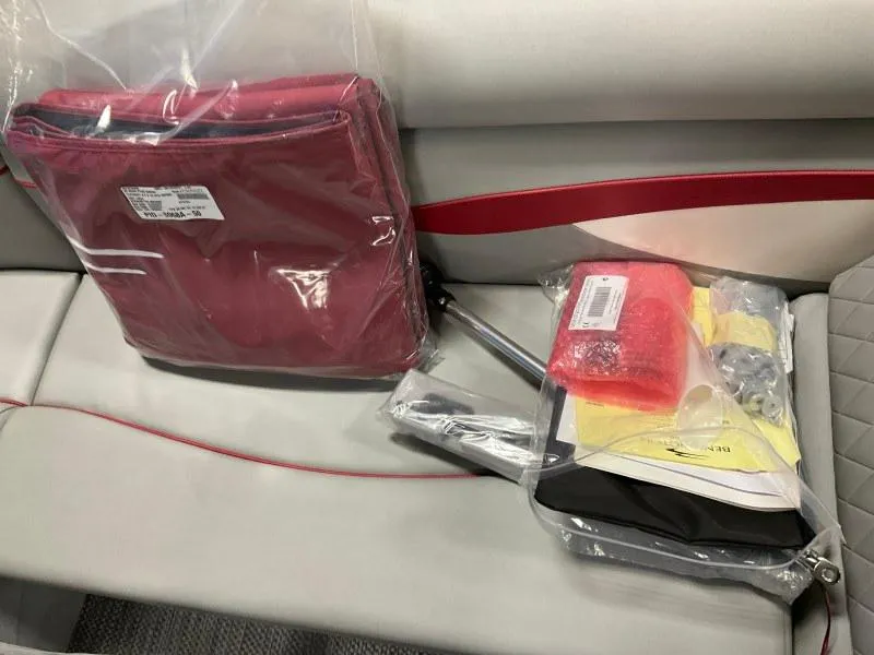 Slide: The Image of 2023 Bennington 20SVF boat interior with packaged accessories on seat. - 17