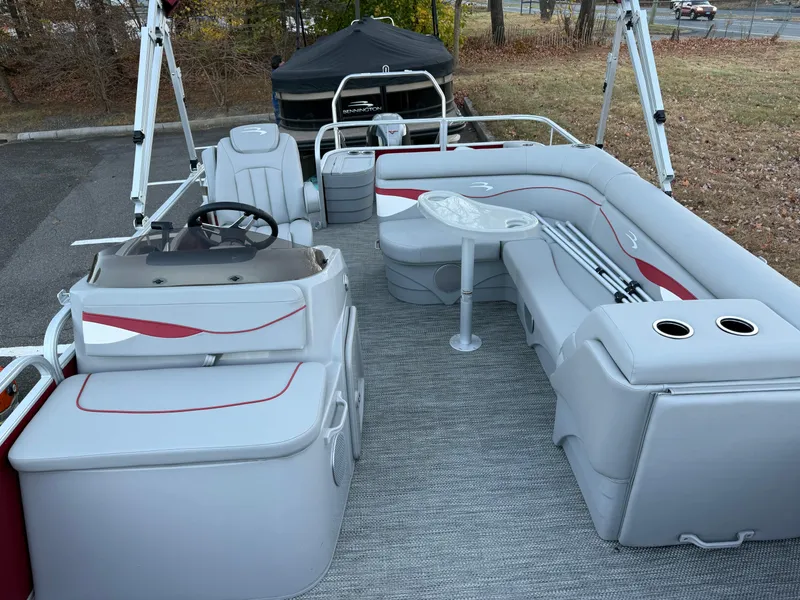Slide: The Image of 2023 Bennington 20SVF pontoon boat interior with gray seating and steering console. - 21