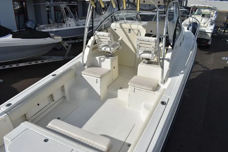 Slide: The Image of 2003 Hydra-Sports 2800 WA Vector boat interior with seating and helm. - 10