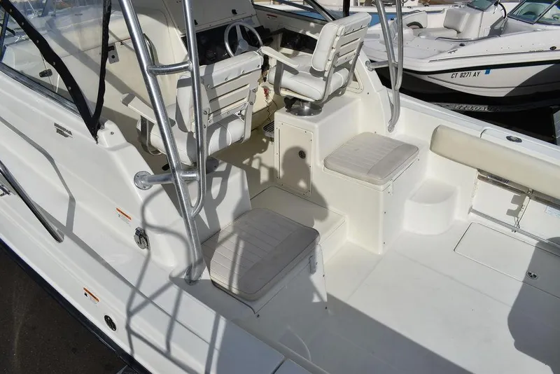 Slide: The Image of 2003 Hydra-Sports 2800 WA Vector boat interior with seating and steering area. - 12