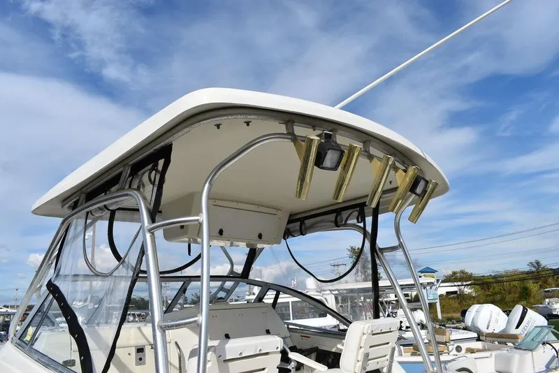 Slide: The Image of 2003 Hydra-Sports 2800 WA Vector boat with T-top and rod holders. - 14