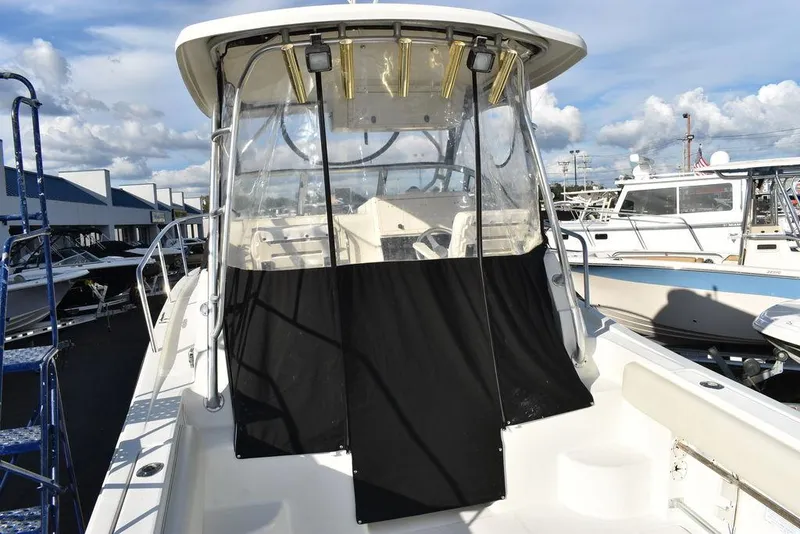 Slide: The Image of 2003 Hydra-Sports 2800 WA Vector boat with covered cockpit, docked at marina. - 17