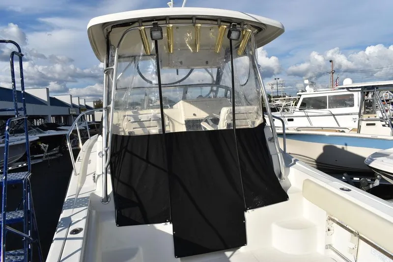 Slide: The Image of 2003 Hydra-Sports 2800 WA Vector boat with covered cockpit, docked at marina. - 18