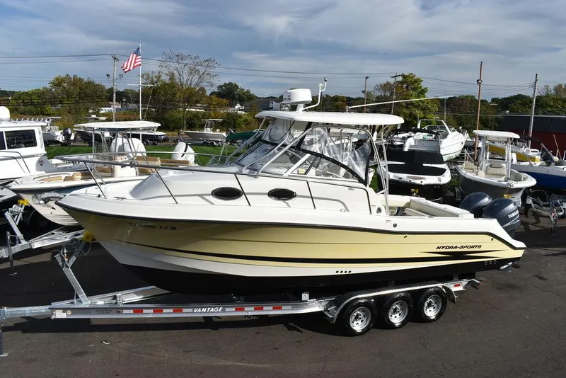 Slide: The Image of 2003 Hydra-Sports 2800 WA Vector boat on trailer, parked in marina. - 2