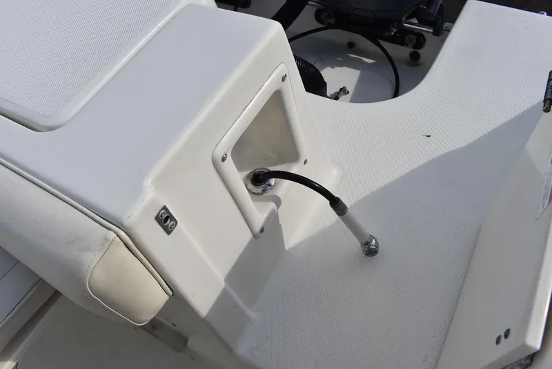 Slide: The Image of 2003 Hydra-Sports 2800 WA Vector boat interior detail with white seating and hydraulic component. - 25