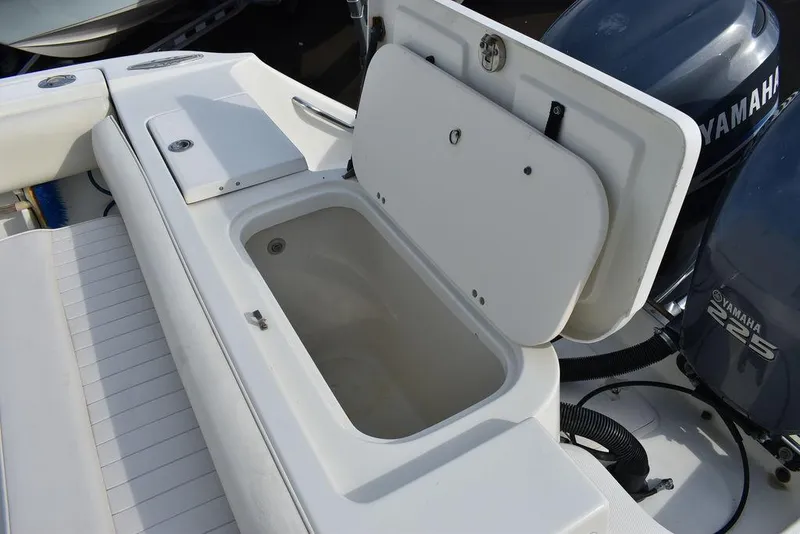 Slide: The Image of Open storage compartment on 2003 Hydra-Sports 2800 WA Vector boat deck. - 27