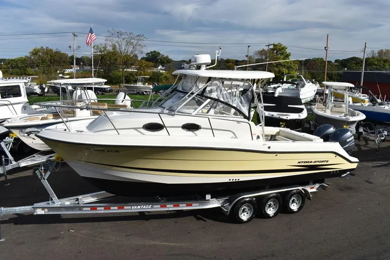 Slide: The Image of 2003 Hydra-Sports 2800 WA Vector boat on trailer, parked in marina. - 3