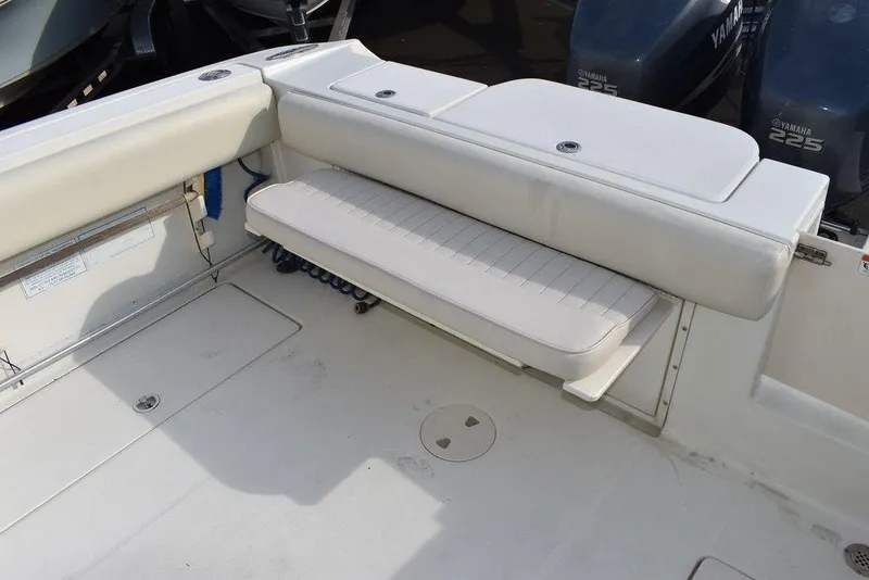 Slide: The Image of 2003 Hydra-Sports 2800 WA Vector boat interior with white seating and storage compartments. - 31