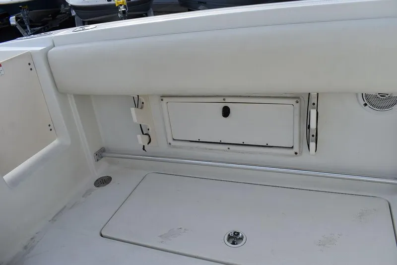 Slide: The Image of 2003 Hydra-Sports 2800 WA Vector boat interior, featuring storage compartment and seating area. - 34