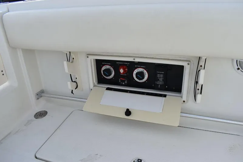 Slide: The Image of Control panel on 2003 Hydra-Sports 2800 WA Vector boat, featuring dials and switches. - 35