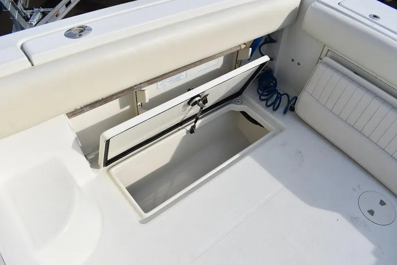 Slide: The Image of Open storage compartment on 2003 Hydra-Sports 2800 WA Vector boat deck. - 37