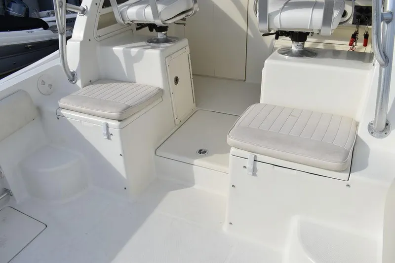Slide: The Image of 2003 Hydra-Sports 2800 WA Vector boat interior with cushioned seating and storage compartments. - 38