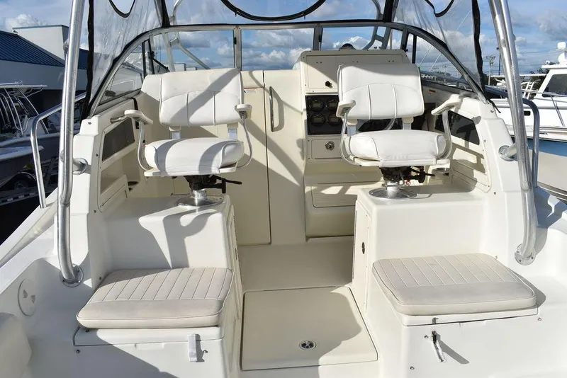 Slide: The Image of 2003 Hydra-Sports 2800 WA Vector boat interior with dual captain chairs and control panel. - 49