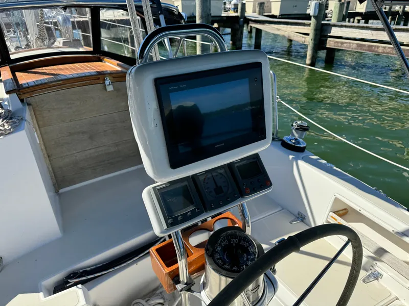 Slide: The Image of Cockpit of 2006 Pacific Seacraft 31 sailboat with navigation equipment and steering wheel. - 7