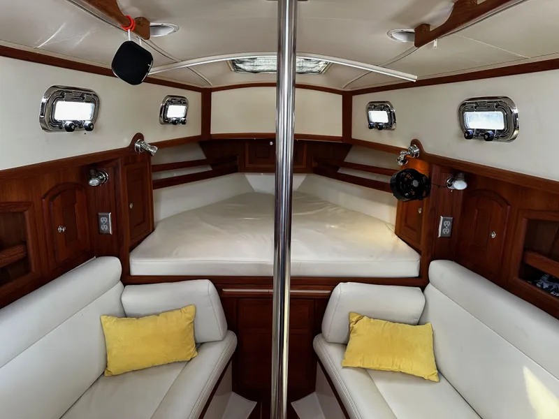 Slide: The Image of Interior of 2006 Pacific Seacraft 31 sailboat with cozy seating and wood finish. - 8