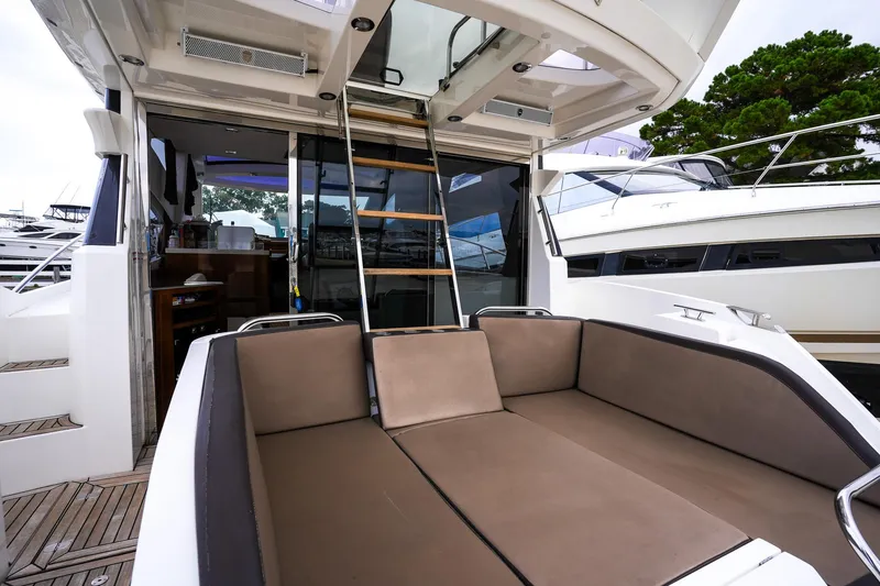Slide: The Image of 2017 Galeon 43 SKY yacht with spacious outdoor seating and modern design. - 19