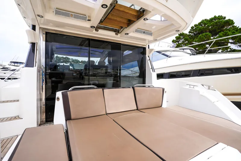 Slide: The Image of 2017 Galeon 43 SKY yacht with spacious outdoor seating area. - 21