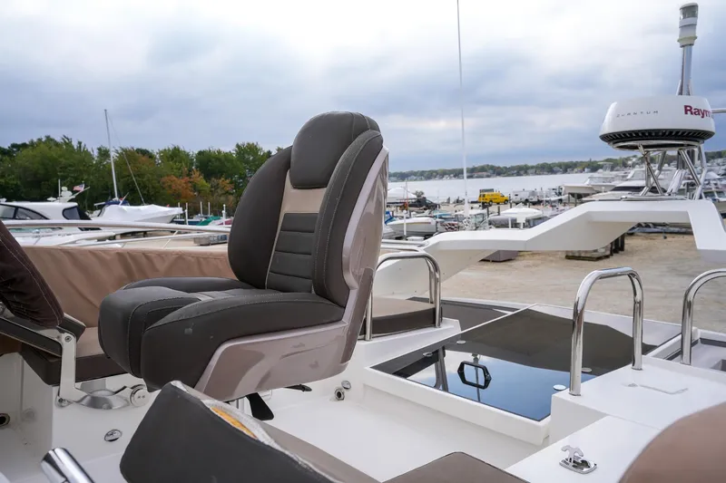 Slide: The Image of Galeon 43 SKY 2017 yacht with luxurious seating and marina view. - 22