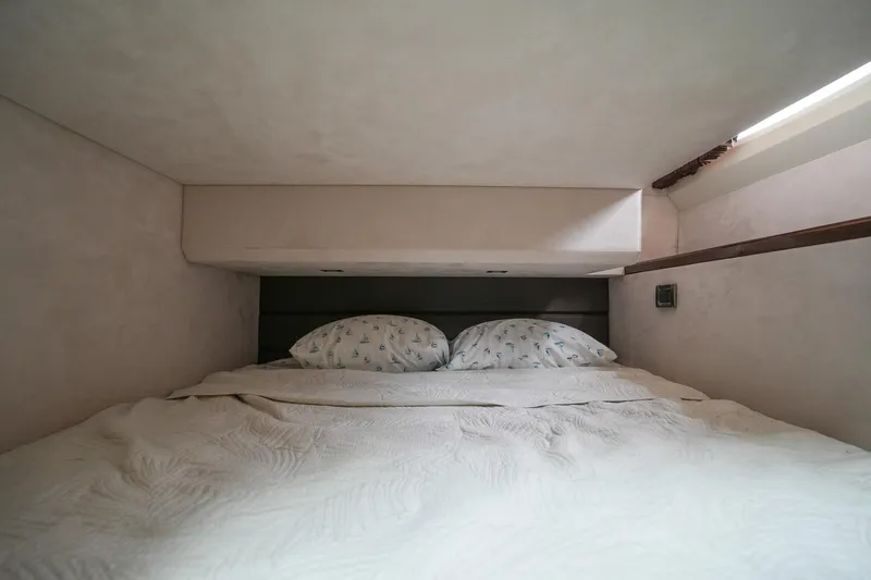 Slide: The Image of Cozy bedroom in 2017 Galeon 43 SKY yacht with double bed and pillows. - 40