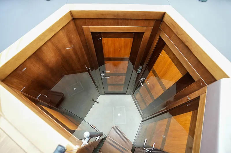 Slide: The Image of Interior view of 2017 Galeon 43 SKY yacht with wooden finishes and glass doors. - 42