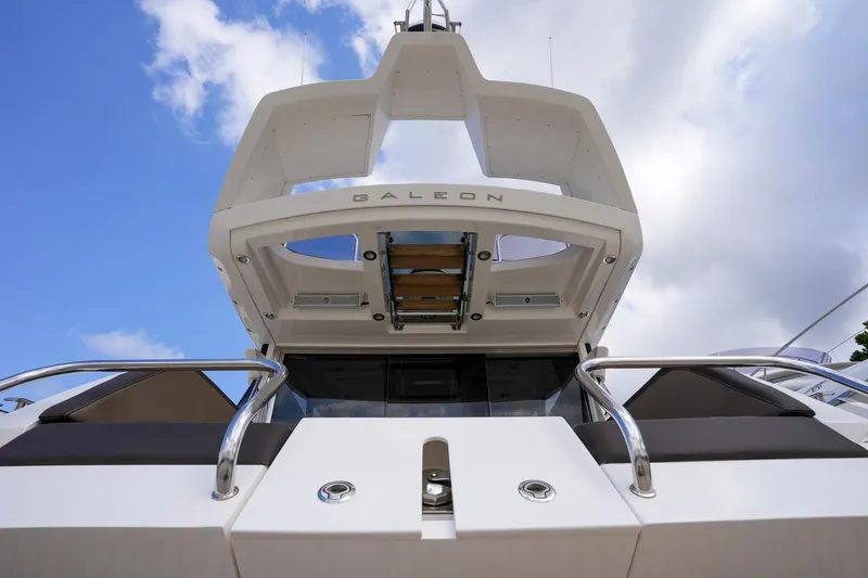 Slide: The Image of 2017 Galeon 43 SKY yacht, rear view under blue sky. - 9