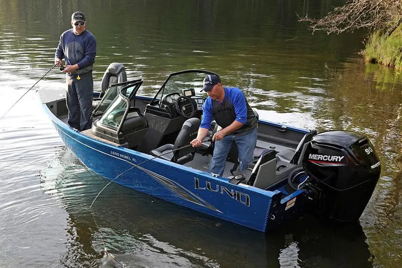 Slide: The Image of 2025 Lund 1650 Rebel XL Sport boat with Mercury 60 engine, blue exterior. - 3
