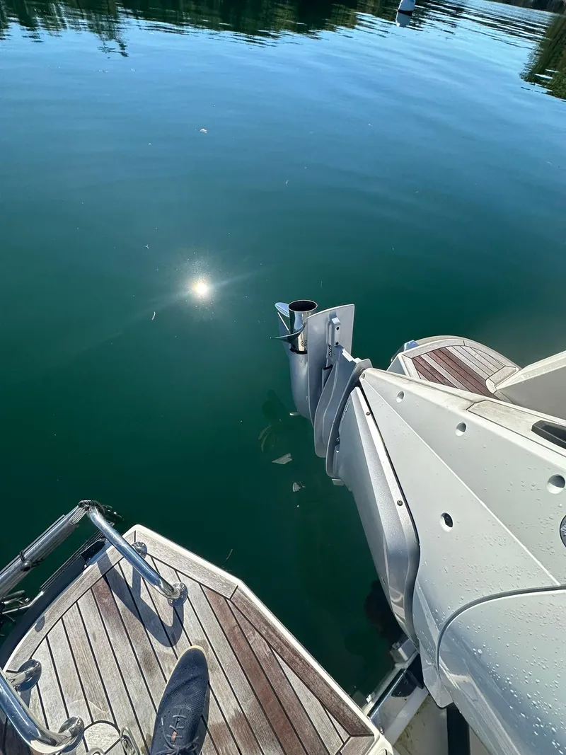 Slide: The Image of Nimbus W9 2021 boat stern with outboard motor on calm water. - 13